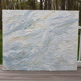 An abstract painting with thickly textured blueish, orangish and greenish beige brushstrokes is seen on the artists deck outside.