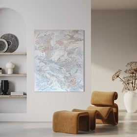 An abstract painting with thickly textured brushstrokes of beige, green, orange, and blue is hung in a family room.