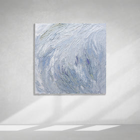A Grey blue, light blue, lavender, celadon and white thickly textured abstract painting hanging on a white wall in natural light by Teodora Guererra.