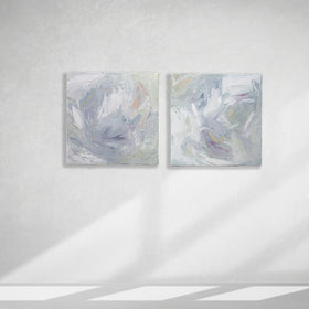 A pair of thickly painted paintings in teal, sea foam green, celadon, white, lavender and yellow by Teodora Guererra hang on a white wall.