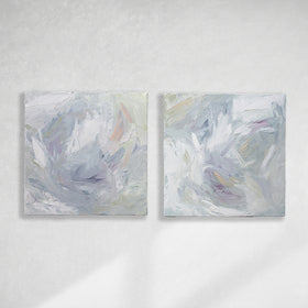 A pair of thickly painted paintings in teal, sea foam green, celadon, white, lavender and yellow by Teodora Guererra hang on a white wall.