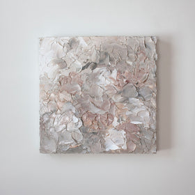 A painting is hanging on a wall. Its surface is decorated with white, pink and grey paint in a thick impasto. Wired and ready to hang.