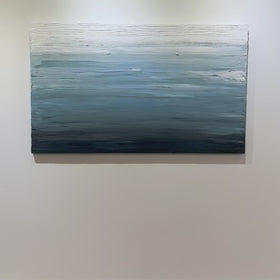 A video of a dark navy blue, light blue, blue, and white thickly textured abstract painting hanging on a white wall in natural light by Teodora Guererra.