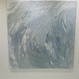 A video of a Grey blue, light blue, lavender, celadon and white thickly textured abstract painting hanging on a white wall in natural light by Teodora Guererra.